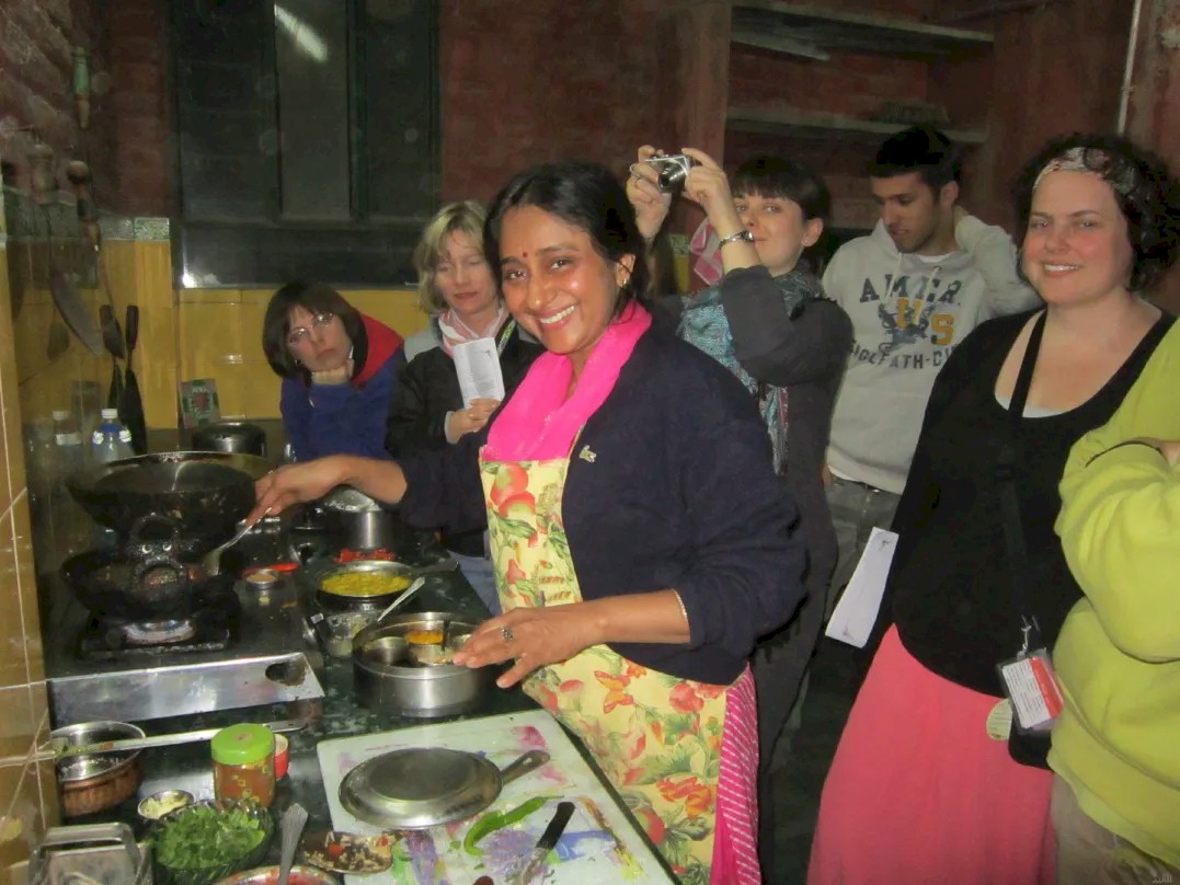 Dr. Smita conducting a cooking class at Sneh Deep Guest House Jaipur